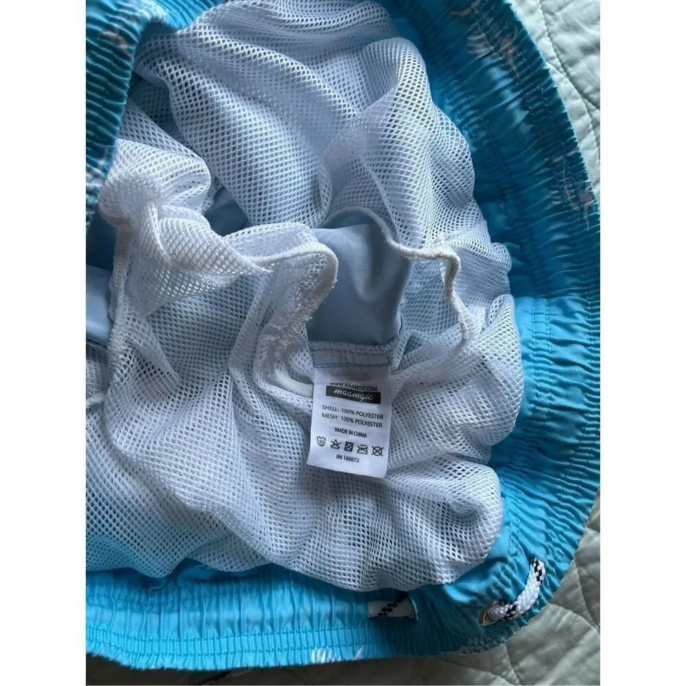 Maamgic light blue swim trunks with white swordfish pattern - XL
